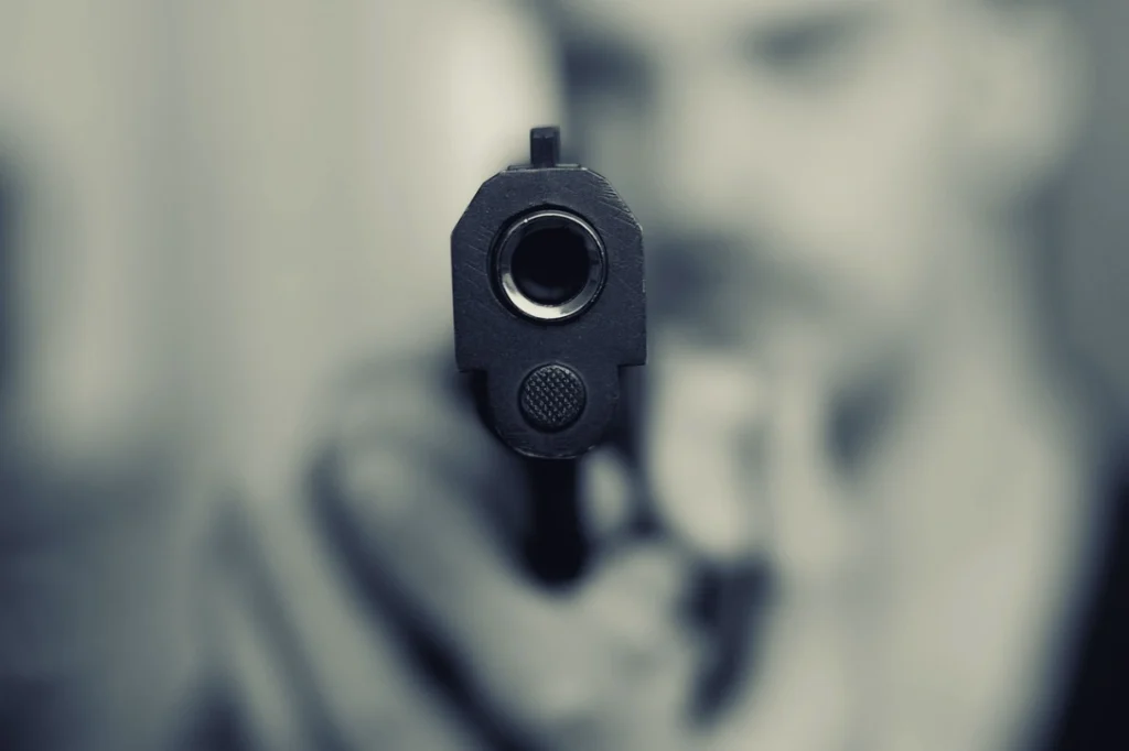 A person pointing a gun.