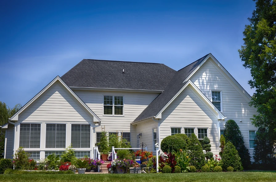 A white, single family home in an suburban environment.
